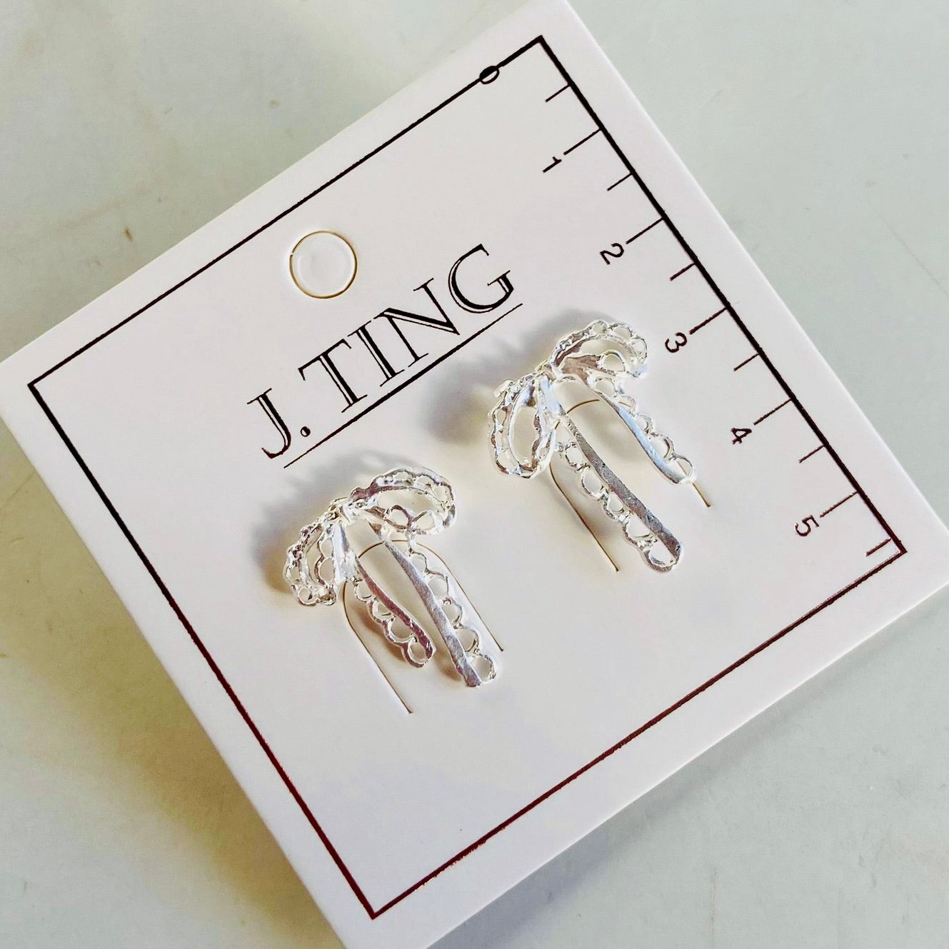 White Silver Bow Earrings