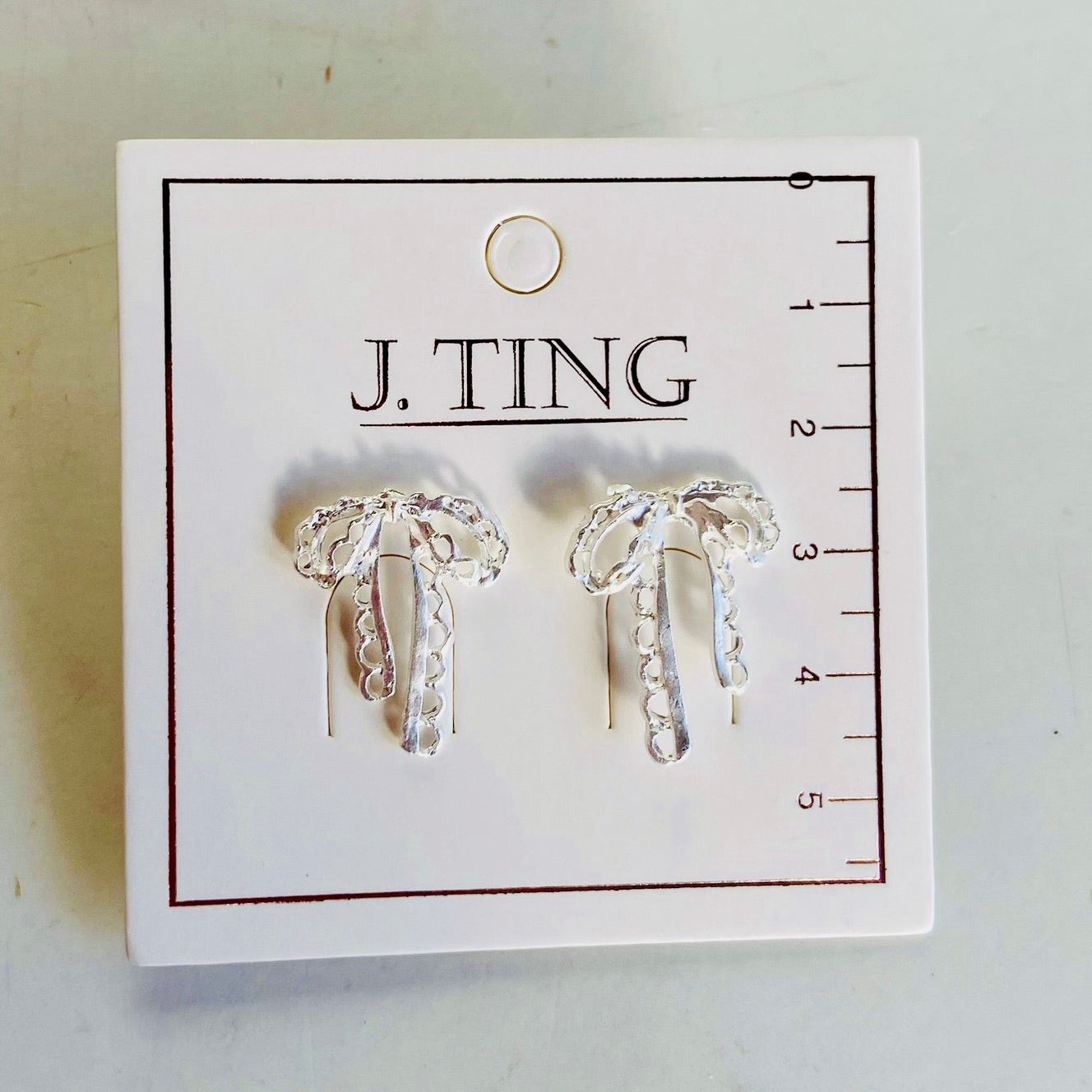 White Silver Bow Earrings